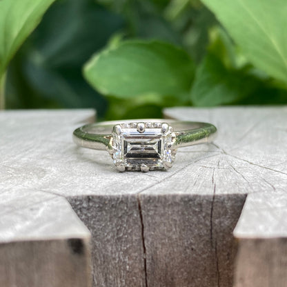 Vintage platinum 0.85ct emerald cut diamond solitaire ring