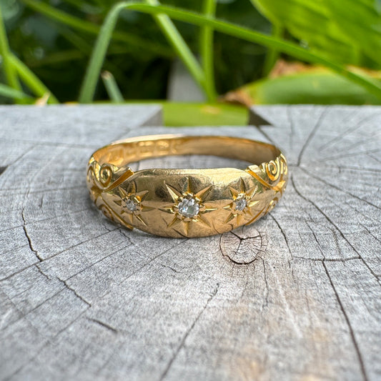 Antique 18ct yellow gold three stone old cut diamond gypsy ring with scrolled shoulders