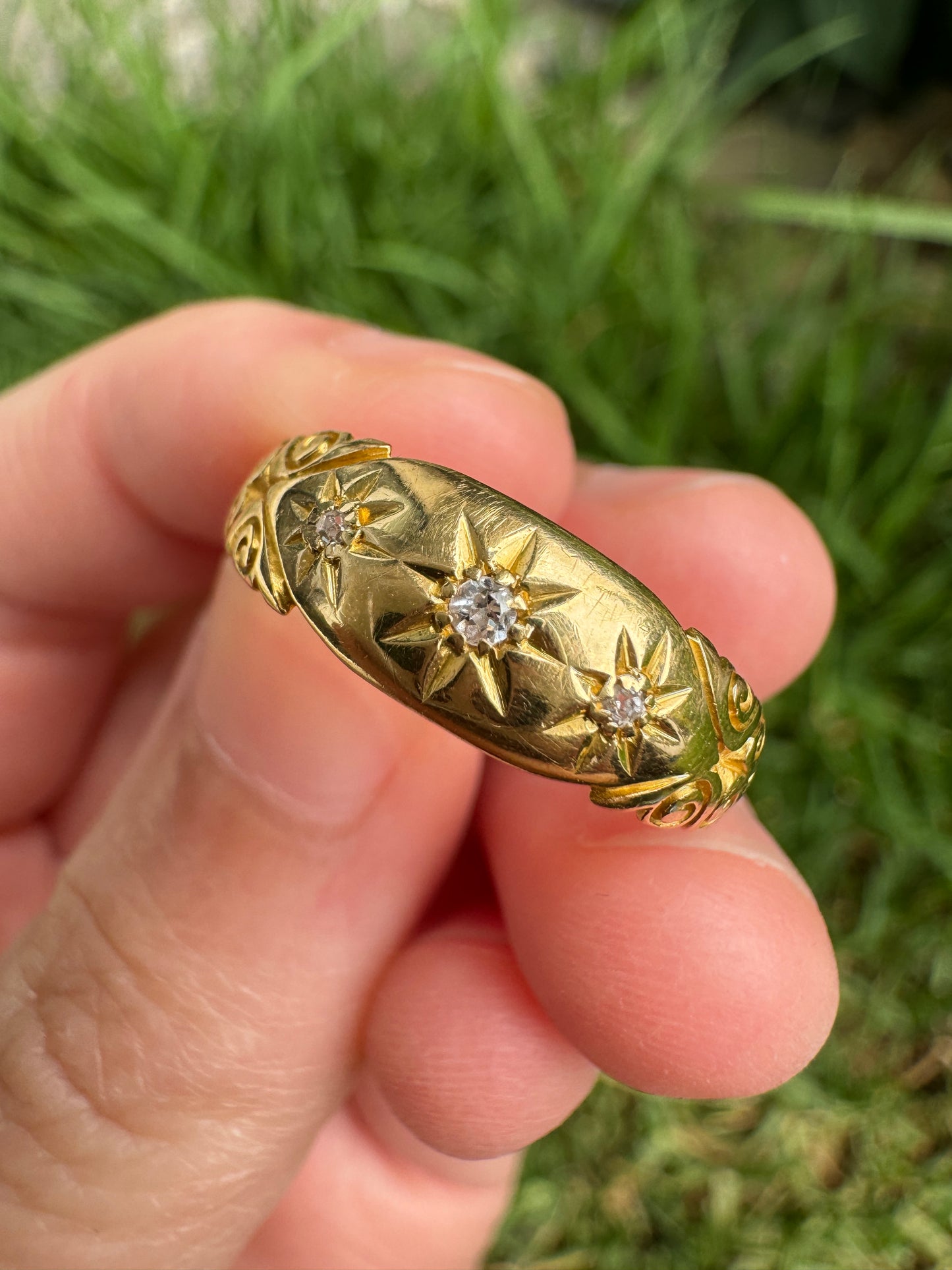 Antique 18ct yellow gold three stone old cut diamond gypsy ring with scrolled shoulders