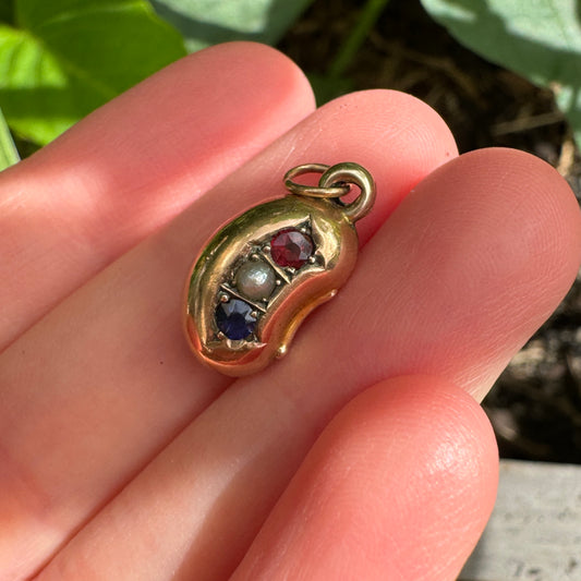 Antique Victorian 9ct yellow gold, garnet and glass doublet and pearl lucky bean charm