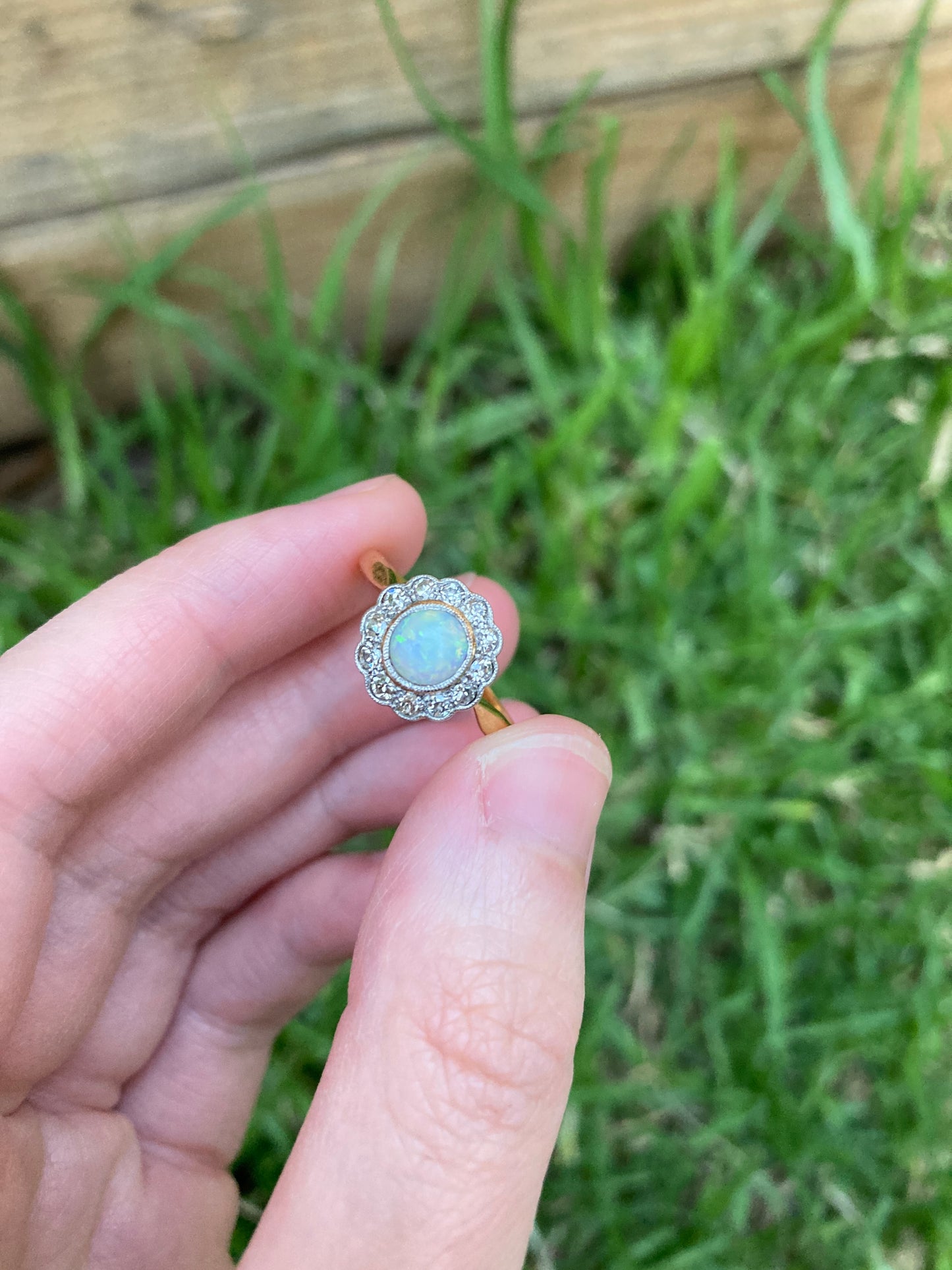 Vintage 18ct yellow gold opal cabochon and old cut diamond halo ring