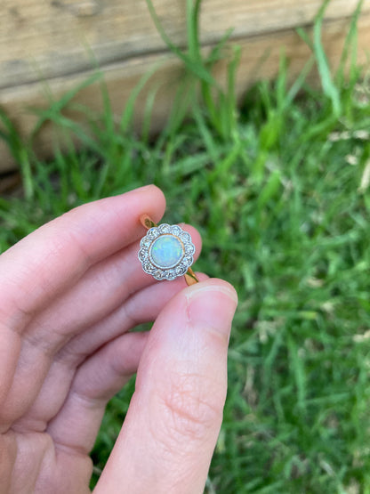 Vintage 18ct yellow gold opal cabochon and old cut diamond halo ring