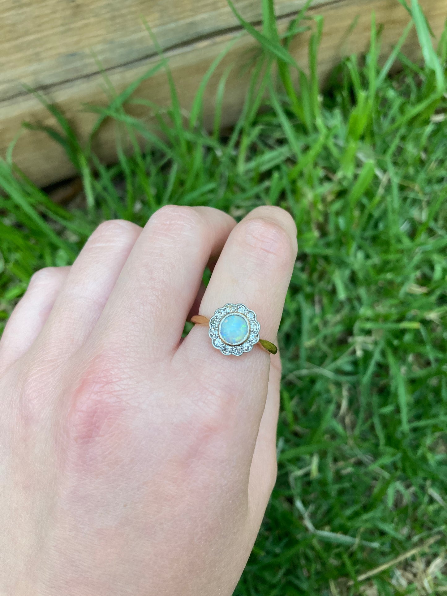Vintage 18ct yellow gold opal cabochon and old cut diamond halo ring