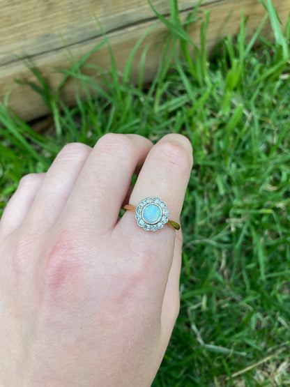 Vintage 18ct yellow gold opal cabochon and old cut diamond halo ring