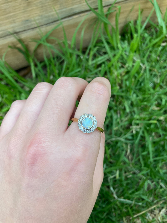 Vintage 18ct yellow gold opal cabochon and old cut diamond halo ring