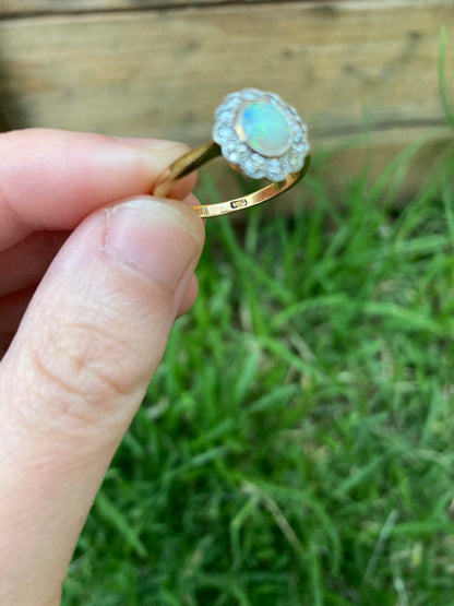Vintage 18ct yellow gold opal cabochon and old cut diamond halo ring