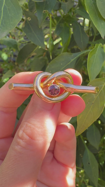 Antique 9ct rosy yellow gold 0.52ct garnet love knot brooch/chain extender