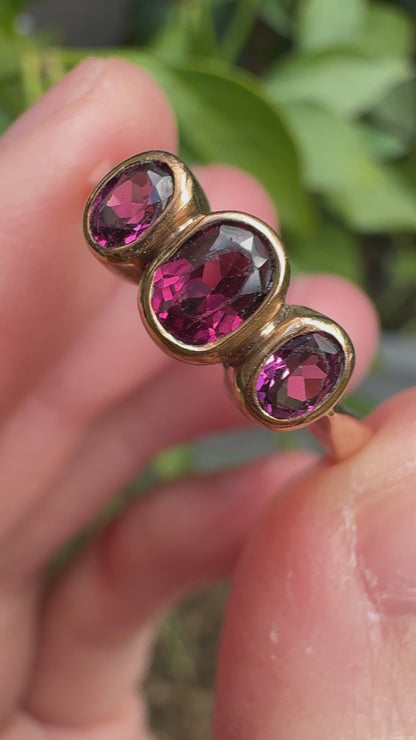Antique 9ct rose gold three stone 0.7ct TCW garnet bezel set ring