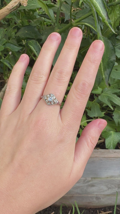 Antique platinum 0.17ct old mine cut and 0.12ct TCW old single cut diamond ring with accent ruby cabochons